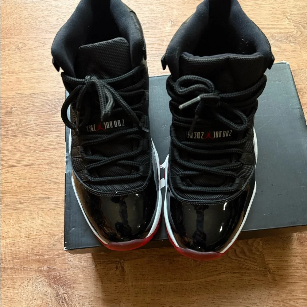 Air Jordan 11 Bred Black and Red High-Top Basketball Sneakers